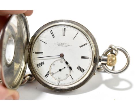 THOMAS RUSSELL OF LIVERPOOL; a Victorian hallmarked silver crown wind half hunter pocket watch suspending a substantial gradu