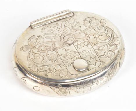 A rare and important 17th century Irish silver snuff box of oval form with engraved scroll and crest to the hinged lid reveal