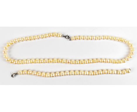 A cultured pearl necklace,&nbsp;length 44cm, with silver clasp and a matching bracelet.,&nbsp;length 18cm (2).Additional Info