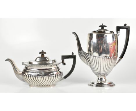 GEORGE NATHAN &amp; RIDLEY HAYES; an Edward VII hallmarked silver teapot, Chester 1902, length 30cm, and a coffee pot, Atkin 