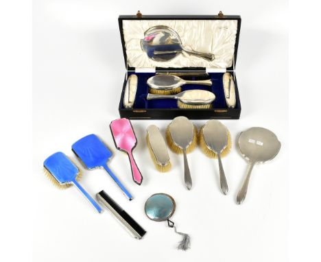 WILLIAM COMYNS & SONS LTD; a George V hallmarked silver five piece dressing table set, London 1926, fitted in original case, 