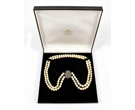 A yellow and white metal clasped pearl necklace set with sapphires and melee diamonds, stamped K18, length 54cm.Additional In