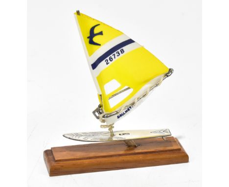 A 925 silver model yacht with plastic sail inscribed ‘Sacchetti’ and bearing no. 26739 on rectangular wooden base, with Londo