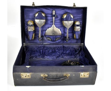 W G SOUTHERS LTD; a George V hallmarked silver five piece travelling vanity set comprising mirror, two clothes and hair brush