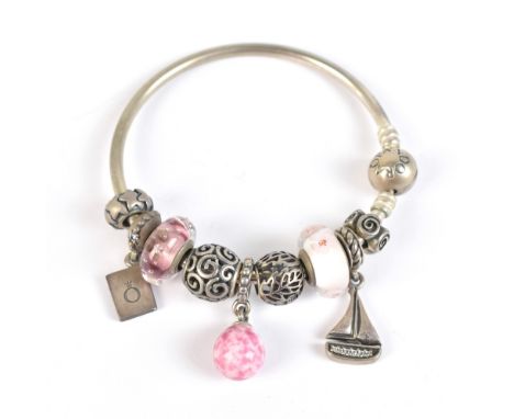 PANDORA; a charm bracelet set with several charms, including one in the form of a sailing boat, approx 31.6g.Additional Infor