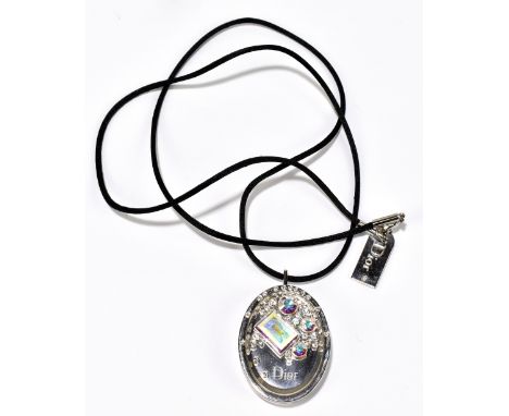 CHRISTIAN DIOR; a pink 'Cristal Boreal' Swarovski pendant necklace with lip gloss, length 72cm (original box).