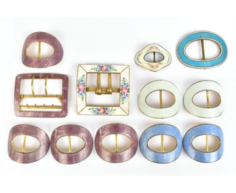 A collection of twelve base metal enamel decorated buckles including a square sectioned floral on cream example, approx 6 x c
