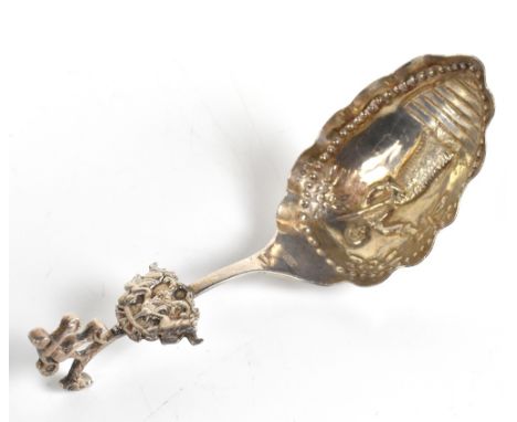 A late 19th century Dutch export silver spoon with cast cherubic finial and further similar applied decoration to handle and 