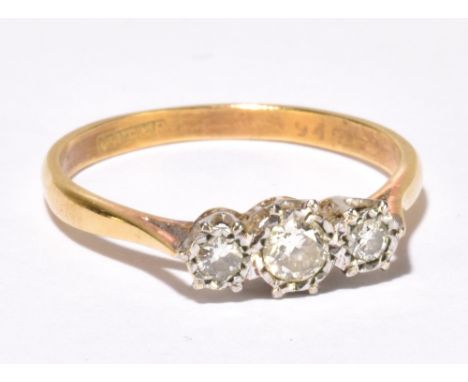 An 18ct yellow gold and platinum tipped illusion set three stone diamond ring, the central stone weighing approx 0.10cts, siz