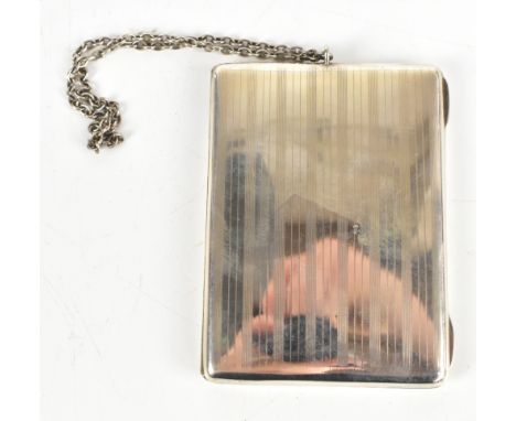 A George V hallmarked silver case with chain wrist loop engraved outer case, the gilt washed interior with spring loaded clip
