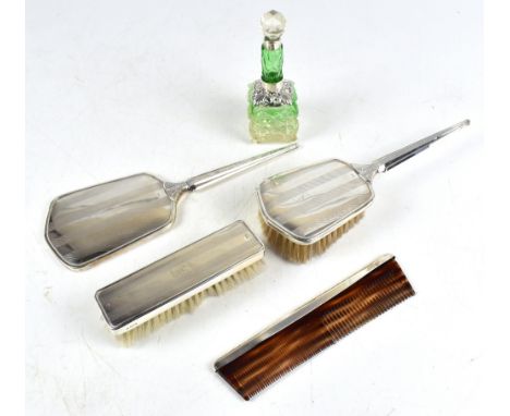 LISSCO PRODUCTS LTD; an Elizabeth II hallmarked silver four piece dressing table set with engine turned banded decoration, ea