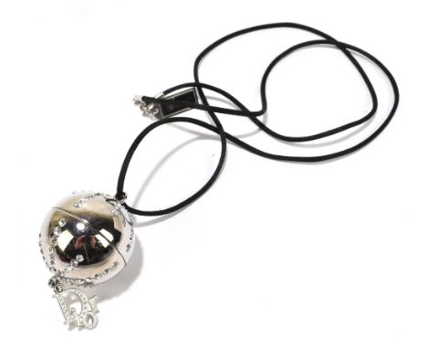 CHRISTIAN DIOR; a 'Diorlight Glosslevres' orb perfume pendant on rope, length 80cm.Additional InformationA small amount of th
