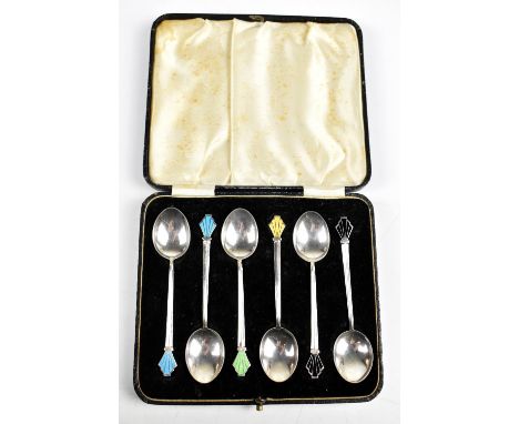 WILLIAM HAIR HASELER LTD; a cased set of six George V hallmarked silver Art Deco tea spoons with enamelled finials, Birmingha