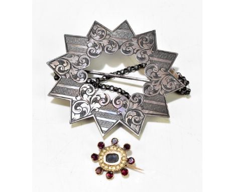 GEORGE UNITE; a white metal star brooch with bright cut detail, stamped and registration marks to reverse, with agate drops o