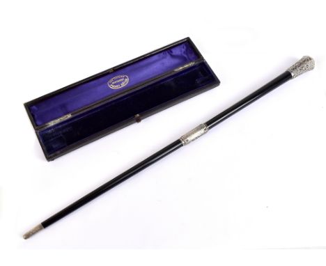 A late Victorian leather cased ebonised and silver mounted two section baton, 'The Handy Pocket Baton', with presentation det