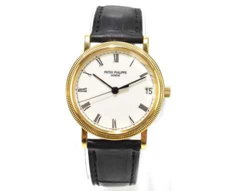 PATEK PHILIPPE; a gentleman’s 18ct gold Calatrava automatic wristwatch, the circular enamel dial with Roman numerals and date