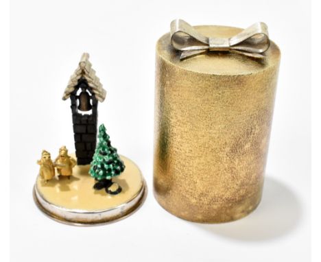 STUART DEVLIN; an Elizabeth II hallmarked silver gilt novelty gift box, the cover enclosing carol singers, church bell and Ch