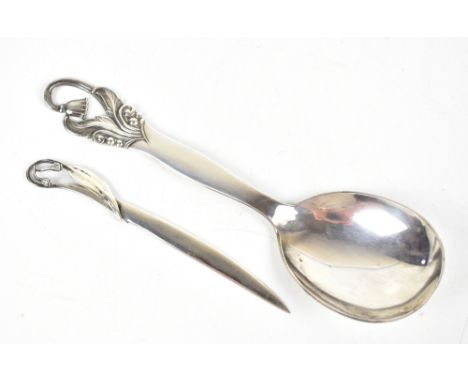 D G S; a Danish white metal spoon with pierced cast detail, length 21.5cm, together with a 925 silver letter opener with pier