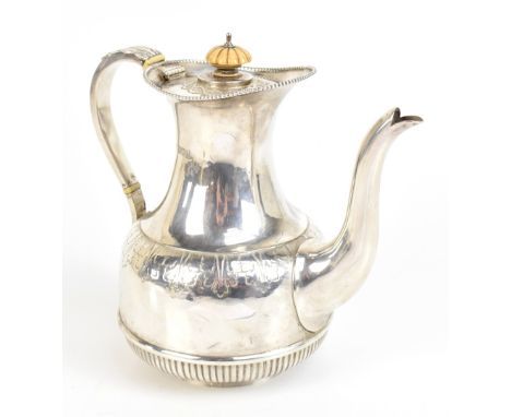 An&nbsp;Edward VII hallmarked silver teapot with band of engraved stylised leaf detail and lower gadrooned section, with ivor