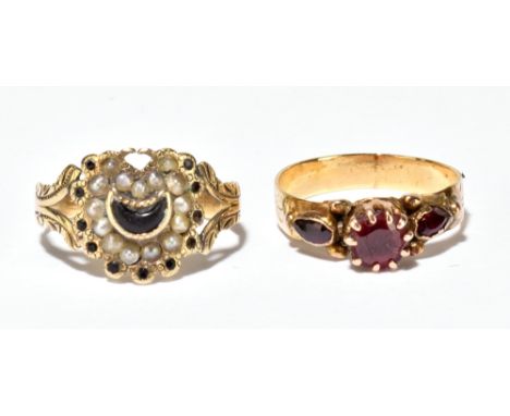 Two early 19th century yellow metal rings, one set with pink stones, the other with seed pearl and black stone crescent, larg