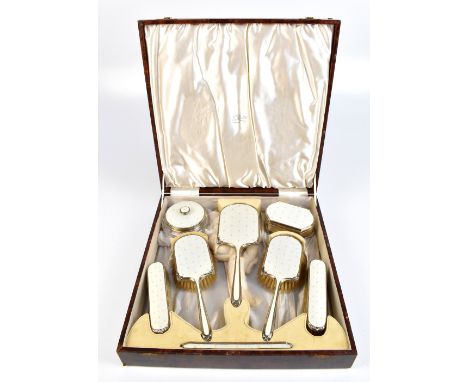 ALBERT CARTER; a cased George VI hallmarked silver and guilloché enamel eight piece dressing table set all with gilt fleur de