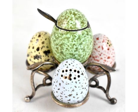 EDWARD H STOCKWELL; a Victorian hallmarked silver and enamel cruet set in the form of birds' eggs with mottled enamel decorat