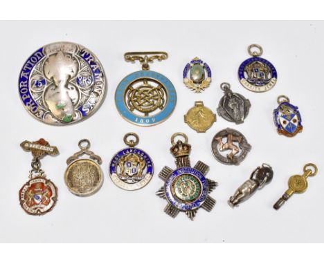 A group of silver fobs, many with enamel decoration including West Lancashire Charity Jewel, 1809 Lodge Benevolence, Masonic 