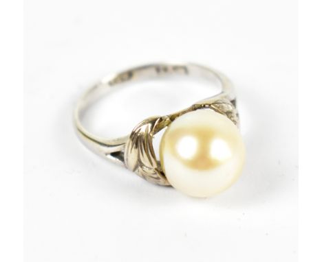 A yellow metal pearl dress ring, stamped 14k, size K, approx 2.9g.Additional InformationThe pearl is yellowing, the white met