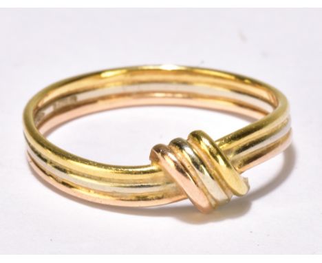 An 18ct gold three tone wire ring, size K/L, approx 2.2g.Additional InformationMarks, scratches&nbsp;commensurate with age, i