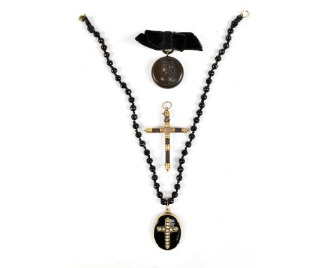 Three small pieces of jewellery&nbsp;comprising a mourning crucifix pendant with braided hair work wrap and central monogramm