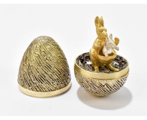 STUART DEVLIN; an Elizabeth II hallmarked silver gilt surprise egg, the detachable cover enclosing a kangaroo and joey, Londo