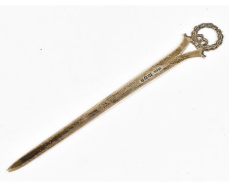 STOKES &amp; IRELAND LTD; an Edward VII hallmarked silver letter opener with laurel wreath and ribbon finial, Chester 1905, l