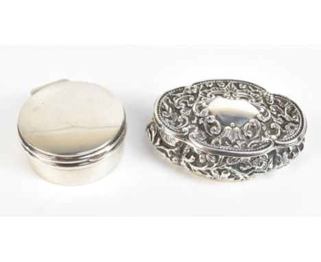 HENRY MATTHEWS; a Victorian hallmarked silver lobed snuff box with repousse foliate scroll decoration, vacant cartouche and g