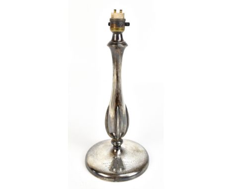 A George V hallmarked silver loaded electric lamp base with ribbed baluster stem and circular foot inscribed ‘Presented to Li