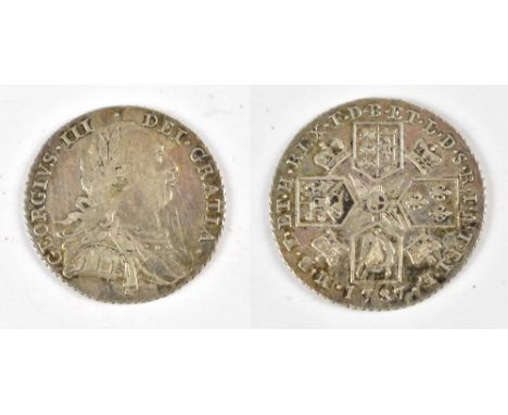 A George III 1787 shilling.Additional InformationSome light scratches and dirt, some toning.