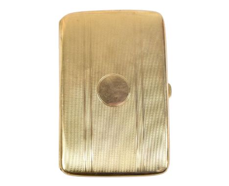 An early 20th century 9ct yellow gold cigarette case of rounded rectangular form with engine turned detail and central vacant