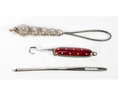 An unmarked silver fish eye bodkin, length 6.4cm, a hallmarked silver patent ribbon threader, Adie &amp; Lovekin Ltd, Birming