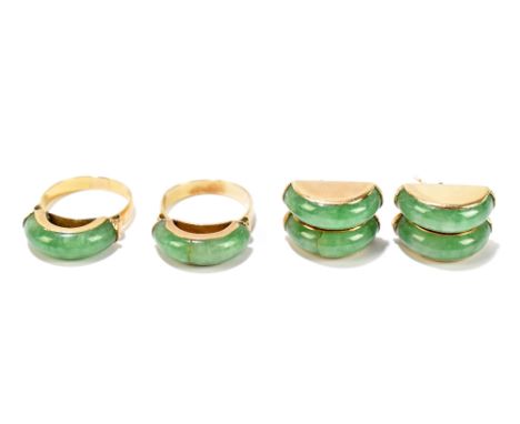 A pair of yellow metal and jade domed rings, size K, and a pair of matching double domed earrings, unmarked.Additional Inform