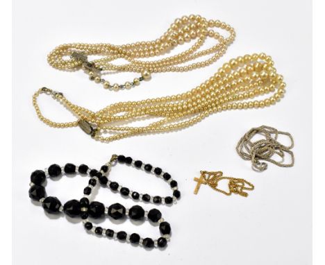 A small group of assorted necklaces including faux pearl and black glass examples.Additional InformationHeavy wear to the cla