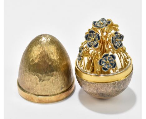 STUART DEVLIN; an Elizabeth II hallmarked silver gilt limited edition surprise egg, the cover enclosing floral sprays and gil