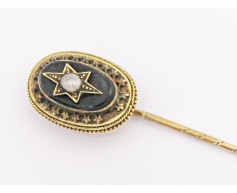 A Victorian yellow metal stick pin set with a pearl, length 7.5cm, gross wt. 4.3g.