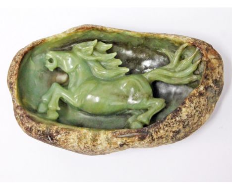 A carved jade boulder depicting a horse, length 17.5cm. Condition - good, no damage/repair.