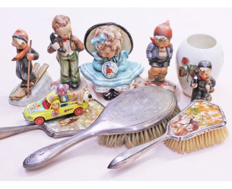 A mixed lot comprising five Hummel figures, a Moorcroft vase, a Corgi Magic Roundabout and a hallmarked silver dressing table