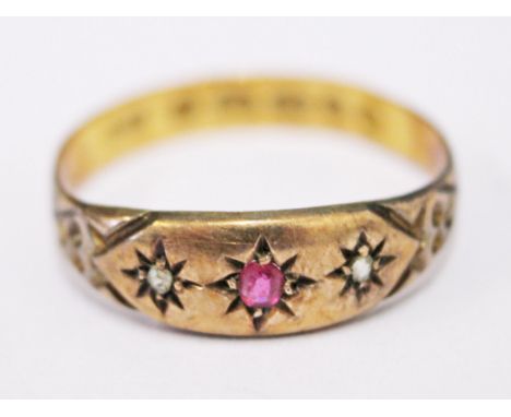 A Victorian 22ct gold diamond and ruby ring, gross wt. 1.9g, size P.