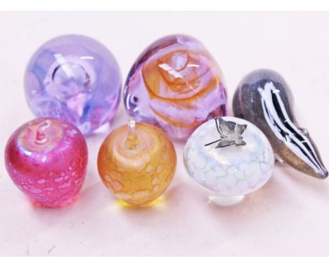 Six pieces of glass comprising two Caithness glass paperweights, two Ditchfield apples and a toadstool and a Langham badger. 