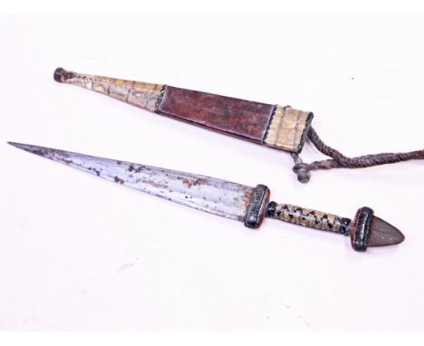 An African dagger with snake skin and leather scabbard, length 33cm. Condition - blade rusty in parts, minor dings but genera