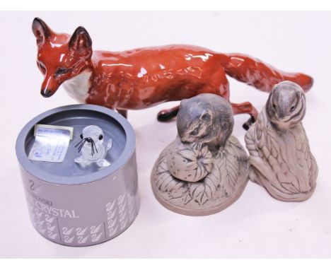 A mixed lot comprising a Beswick fox, two Poole animals and a Swarovski seal pup. Condition - good, no damage/repair.