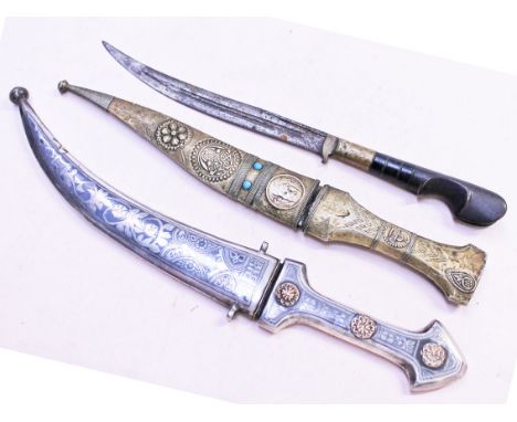 Three eastern daggers, longest 33cm. Condition - one missing scabbard, generally a little rusty.