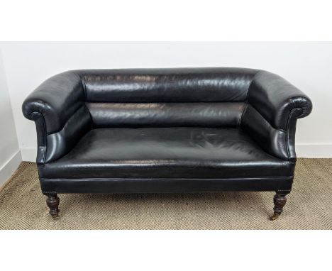 CHESTERFIELD SOFA, Victorian mahogany in black leather on ceramic castors, 76cm H x 157cm x 82cm. 