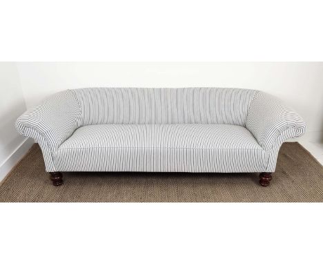 CHESTERFIELD SOFA, Victorian design mahogany in new ticking on turned feet, 63cm H x 217cm x 84cm. 